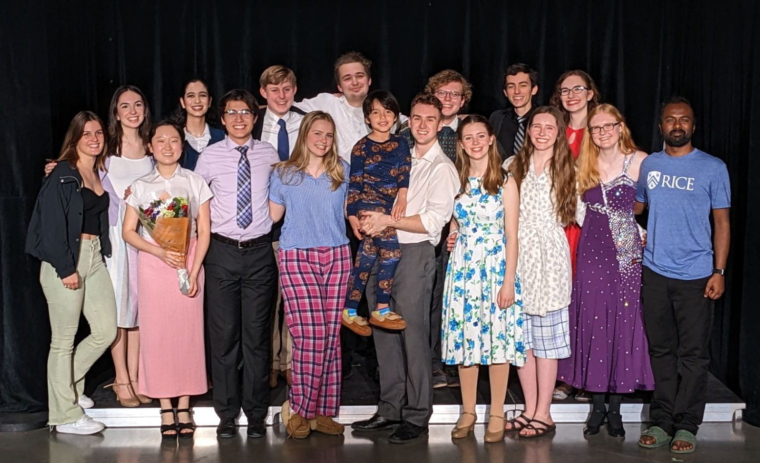The cast and crew of Merrily We Roll Along, gathered for a picture in costume onstage